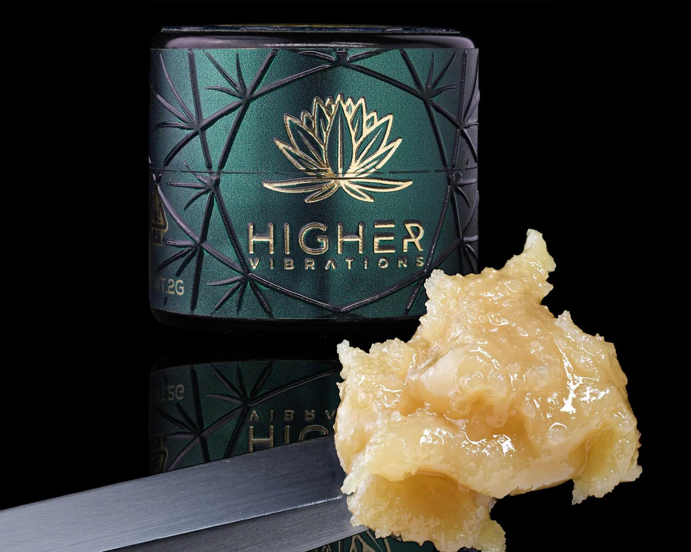 Cold cure live rosin next to Higher Vibrations jar, showcasing solventless extract using ice, water, and pressure